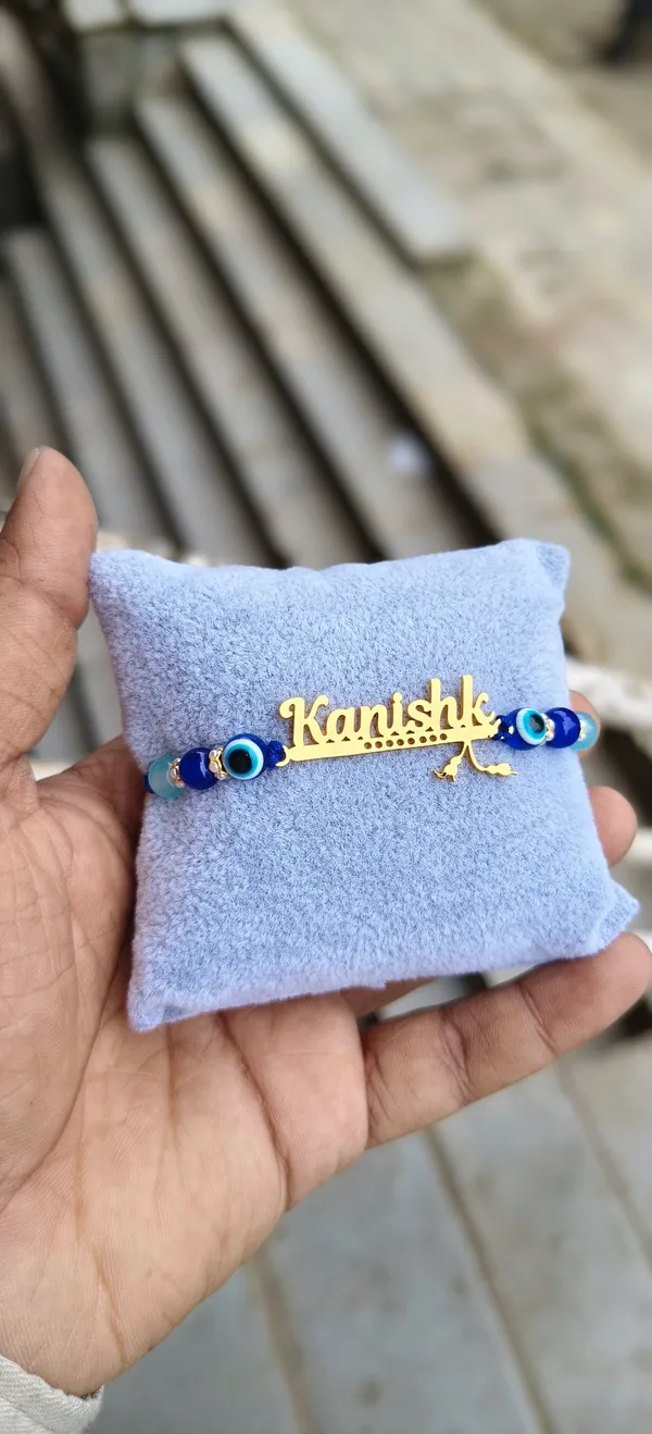 Personalized_Name_Rakhi_for_Brother_with_Evil_Eye_Beads_-_Custom_Gold_Plated_Name_Bracelet_Rakhi_-_Unique_Rakshabandhan_Gift_for_Brother