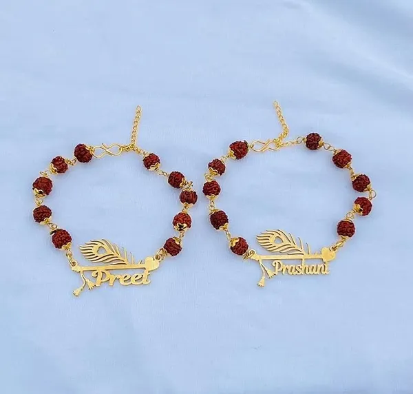 Personalized_Name_Rakhi_with_Flute_&_Peacock_Feather_Design_–_Custom_Gold-Finish_Religious_Rakhi_for_Brother