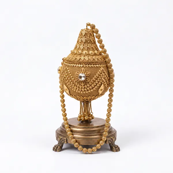 Coconut_Shaped_Metal_Potli_Bag_With_Metal_Beaded_Handle