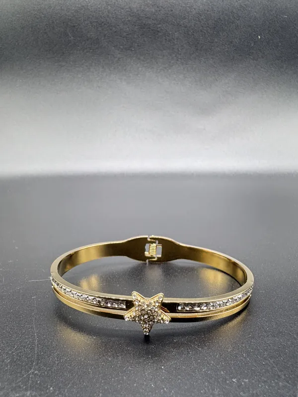 Gold-Toned_Star_Charm_Bracelet_With_Crystal_Embellishments