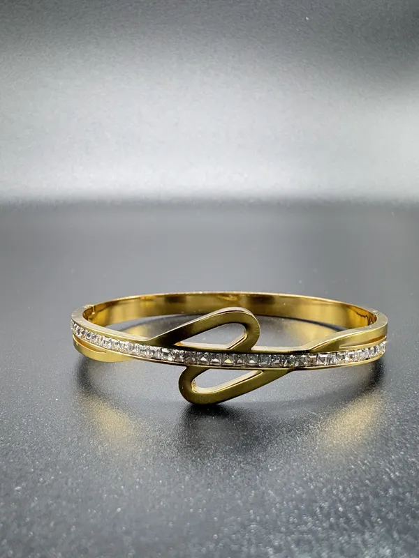 Elegant_Gold-Tone_Bangle_With_Crystal_Embellishments