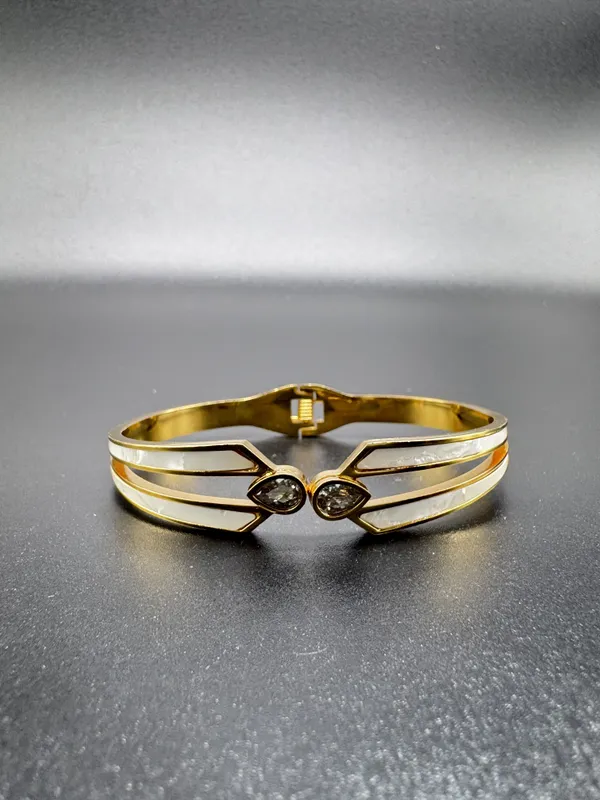 Elegant_Gold-Toned_Bracelet_With_Black_Stone_Accents