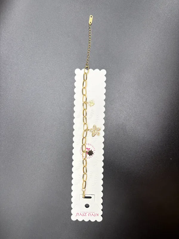 Gold-Toned_Chain_Bracelet_With_Floral_Charms