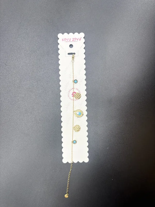 Golden_Chain_Bracelet_With_Crystal_And_Textured_Disc_Charms