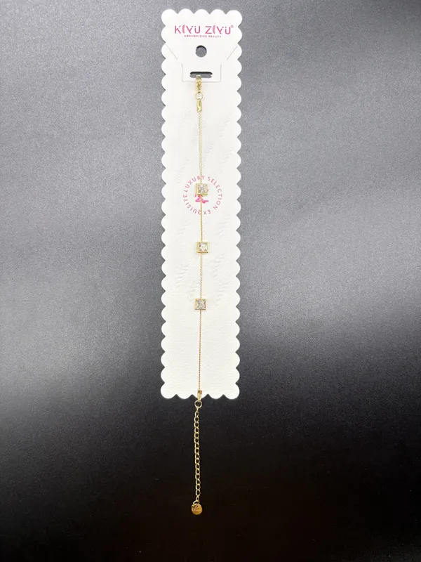 Gold-Toned_Delicate_Chain_Bracelet_With_Letter_Charms