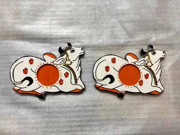 Pair_of_2_Handcrafted_White_And_Orange_Decorative_Pitchwai_Cow_Tea_Light_Holder