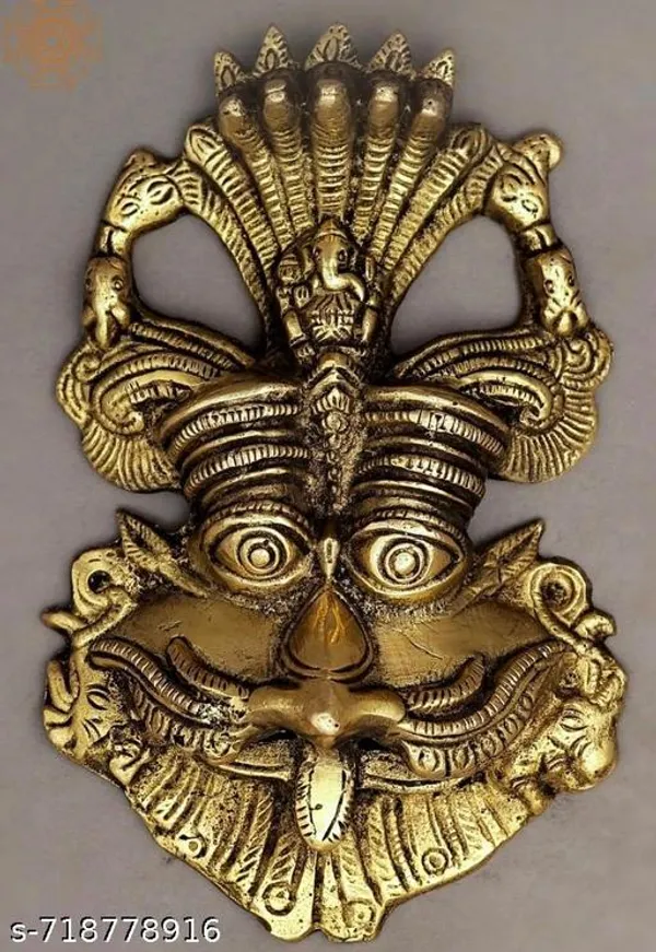Metal_Gold_Nazar_Battu_With_Naag_Ganesha_For_Evil_Eye_Protection_And_Nazar_Suraksha_Bad_Eye_Suraksha_Kavach_Mask_For_Home_Office_Wall_Door_Hanging_Decor_Accessories_Feng_Shui_Vastu_Showpiece_Wall_Hanging_Is_A_Representation_Of_A_Kirtimukha_With_A_Seated_Ganesha_Figure_On_Top