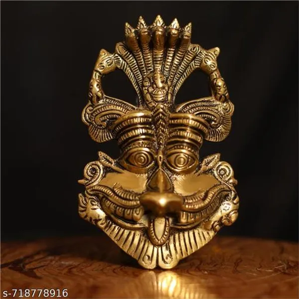 Metal_Gold_Nazar_Battu_With_Naag_Ganesha_For_Evil_Eye_Protection_And_Nazar_Suraksha_Bad_Eye_Suraksha_Kavach_Mask_For_Home_Office_Wall_Door_Hanging_Decor_Accessories_Feng_Shui_Vastu_Showpiece_Wall_Hanging_Is_A_Representation_Of_A_Kirtimukha_With_A_Seated_Ganesha_Figure_On_Top
