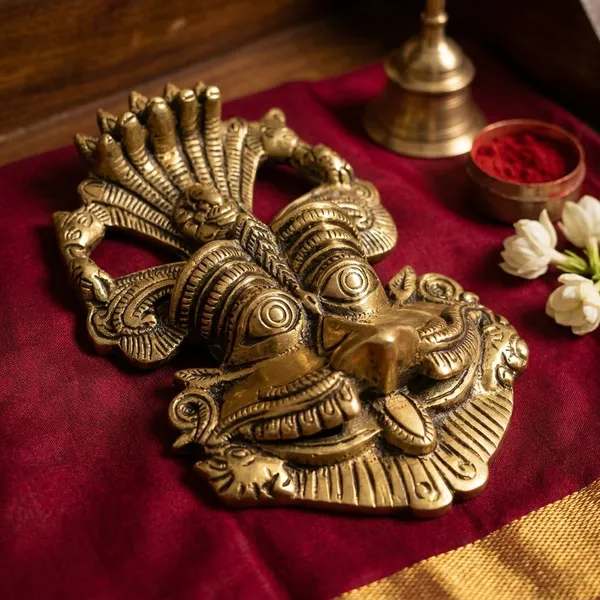 Metal_Gold_Nazar_Battu_With_Naag_Ganesha_For_Evil_Eye_Protection_And_Nazar_Suraksha_Bad_Eye_Suraksha_Kavach_Mask_For_Home_Office_Wall_Door_Hanging_Decor_Accessories_Feng_Shui_Vastu_Showpiece_Wall_Hanging_Is_A_Representation_Of_A_Kirtimukha_With_A_Seated_Ganesha_Figure_On_Top