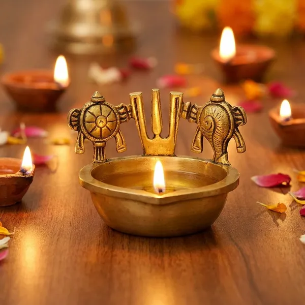 Handcrafted_Brass_Shankh_Chakra_Namah_Diya_A_Traditional_Indian_Oil_Lamp_Often_Used_For_Worship_And_Home_Decor