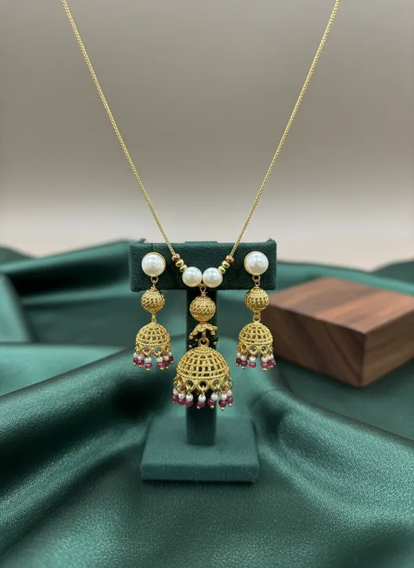 Gold_Jhumka_Pendant_Necklace_Set_With_Pearl_And_Ruby_Drops