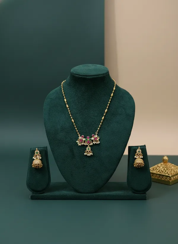 Antique_Gold_Floral_Necklace_Set_With_Jhumka_Earrings