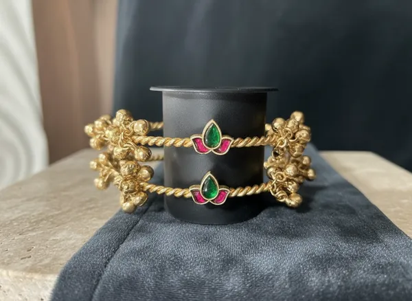 Antique_Gold_Twisted_Rope_Bangles_With_Ruby_And_Emerald_Motif_And_Ghungroo_Drops