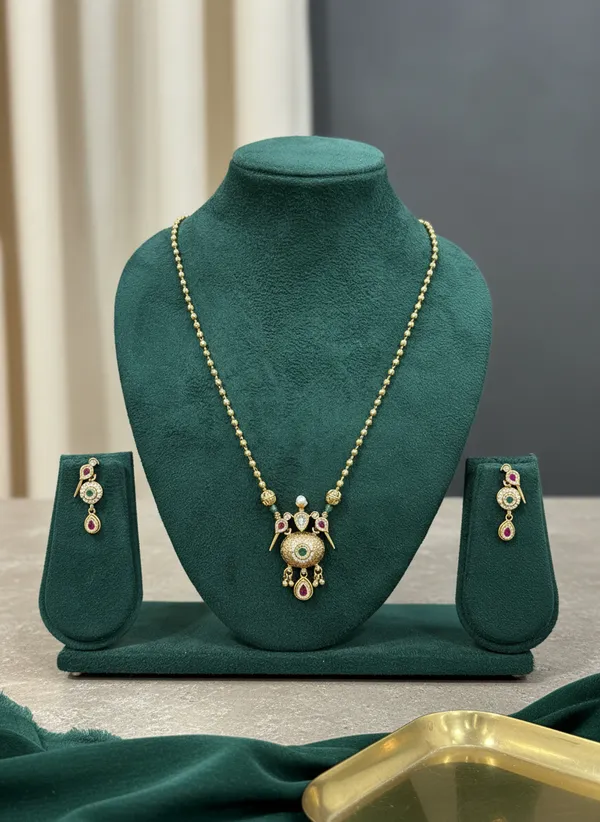 Antique_Gold_Peacock_Necklace_Set_With_Ruby_And_Emerald_Drops