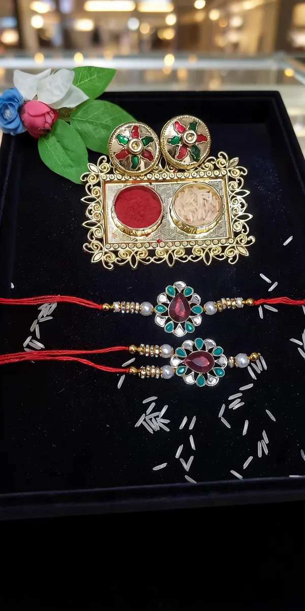 Green_And_White_Rakhi,_Lumba,_Bracelet,_Chawal_Roli_Pack_Alloy_For_Brother_And_Sister-In-Law_Pack_Of_2