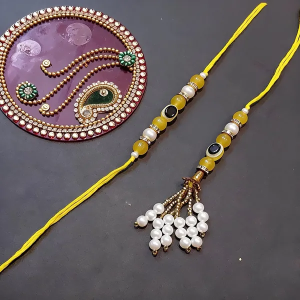 Light_Yellow_Rakhi,_Bracelet_Alloy_For_Brother_And_Sister-In-Law_Pack_Of_2