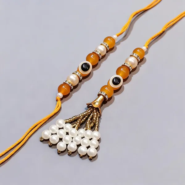 Orange_Rakhi,_Bracelet_Alloy_For_Brother_And_Sister-In-Law_Pack_Of_2