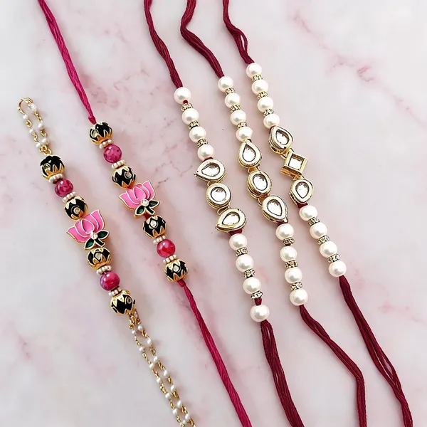 Red_N_White_Gold_Rakhi,_Lumba_Alloy_For_Brother_And_Sister-In-Law_Pack_Of_2
