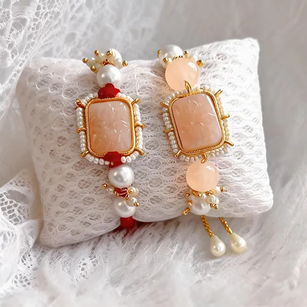 Peach_And_White_Rakhi,_Lumba,_Bracelet,_Thali,_Chawal_Roli_Pack_Alloy_For_Brother_And_Sister-In-Law_Pack_Of_2