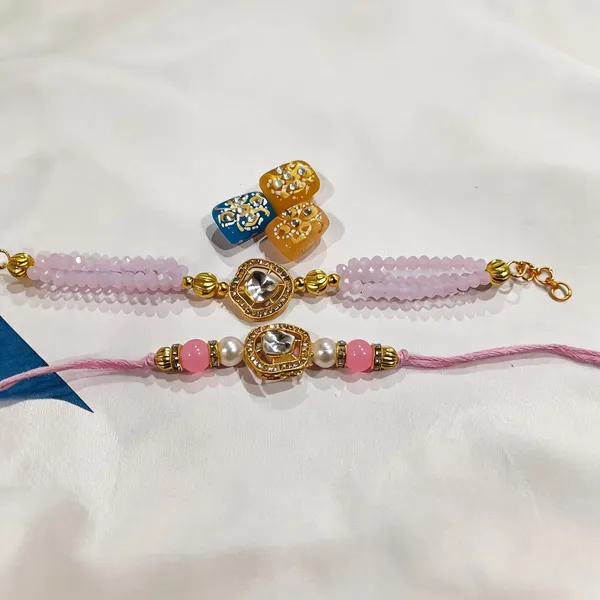 Light_Pink_And_Golden_Rakhi,_Bracelet,_Chawal_Roli_Pack_Alloy_For_Brother_And_Sister-In-Law_Pack_Of_2