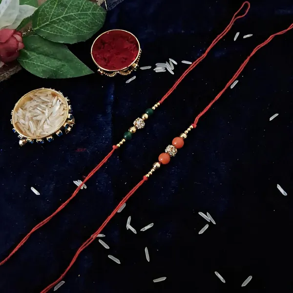 Orange_And_Green_Rakhi,_Lumba,_Bracelet,_Chawal_Roli_Pack_Alloy_For_Brother_And_Sister-In-Law_Pack_Of_2