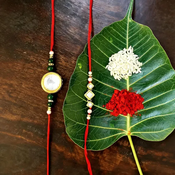 Red_And_White_Rakhi,_Lumba,_Bracelet,_Bluetooth_Rakhi,_Chawal_Roli_Pack_Alloy_For_Brother_And_Sister-In-Law_Pack_Of_2