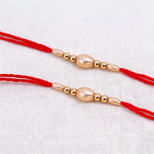 Golden_Rakhi,_Bracelet,_Chawal_Roli_Pack_Alloy_For_Brother_And_Sister-In-Law_Pack_Of_2
