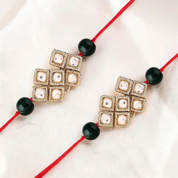 Green_And_White_Rakhi,_Lumba,_Bracelet,_Earrings,_Chawal_Roli_Pack_Alloy_For_Brother_And_Sister-In-Law_Pack_Of_2