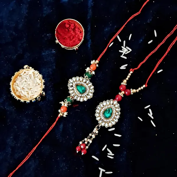 Red_And_White_Rakhi,_Bracelet,_Chawal_Roli_Pack_Alloy_For_Brother_And_Sister-In-Law_Pack_Of_2