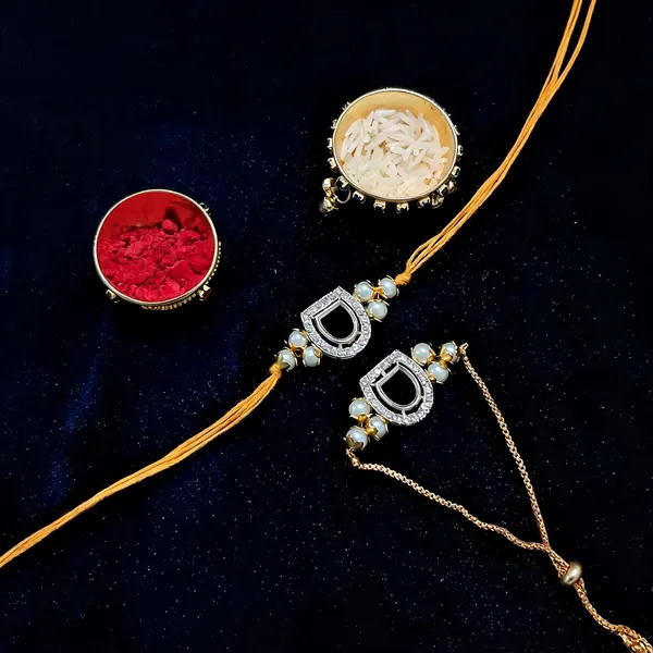 White_Rakhi,_Lumba,_Bracelet,_Bluetooth_Rakhi,_Chawal_Roli_Pack_Alloy_For_Brother_And_Sister-In-Law_Pack_Of_2