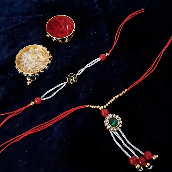 Red_And_White_Rakhi,_Bracelet,_Chawal_Roli_Pack_Alloy_For_Brother_And_Sister-In-Law_Pack_Of_2