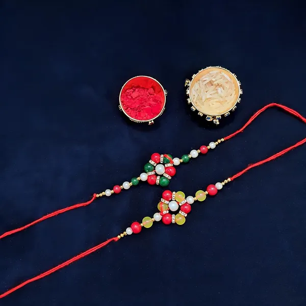 Red_Rakhi,_Chawal_Roli_Pack_Alloy_For_Brother_And_Sister-In-Law_Pack_Of_2