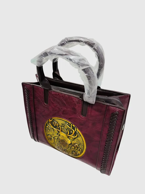 Maroon_Embossed_Tiger_Medallion_Handbag_With_Gold_Detailing
