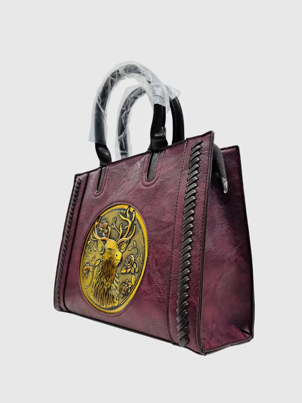 Maroon_Embossed_Tiger_Medallion_Handbag_With_Gold_Detailing