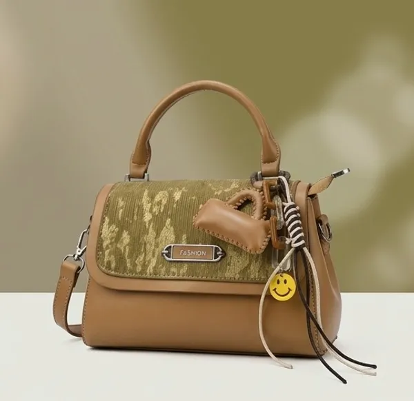 Tan_Handbag_With_Braided_Handle_And_Metal_Hardware