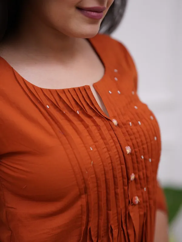 Women's_Rust_Orange_Embroidered_A-Line_Kurta_with_Pintuck_Yoke_&_Floral_Sleeve_Detailing_.