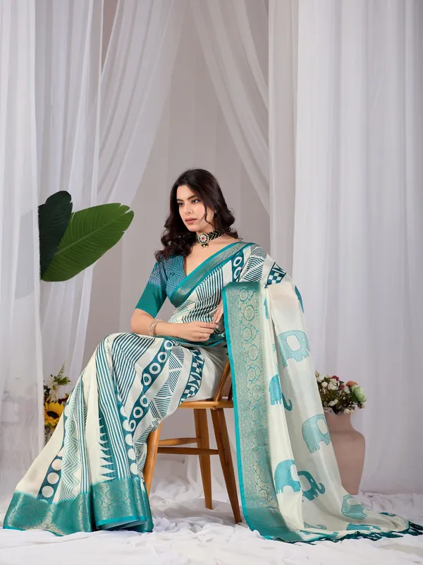 Off-White_&_Teal_Elephant_Print_Soft_Lichi_Silk_Saree_with_Woven_Border_&_Contrast_Blouse