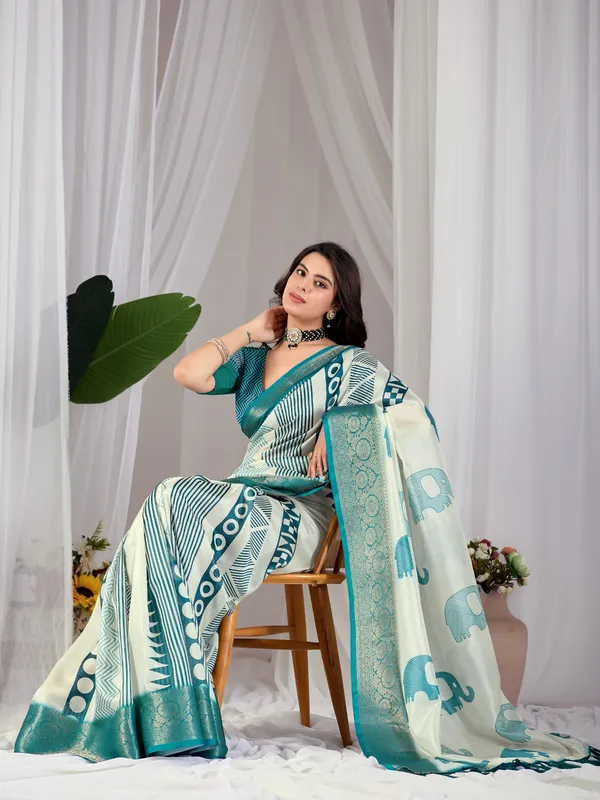 Off-White_&_Teal_Elephant_Print_Soft_Lichi_Silk_Saree_with_Woven_Border_&_Contrast_Blouse