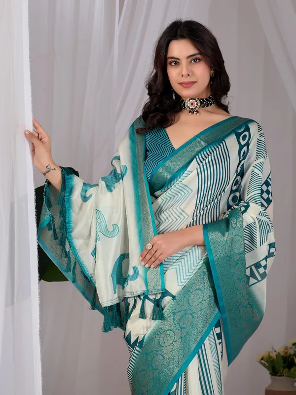 Off-White_&_Teal_Elephant_Print_Soft_Lichi_Silk_Saree_with_Woven_Border_&_Contrast_Blouse