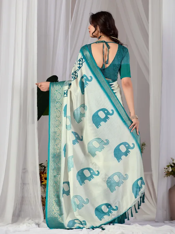 Off-White_&_Teal_Elephant_Print_Soft_Lichi_Silk_Saree_with_Woven_Border_&_Contrast_Blouse