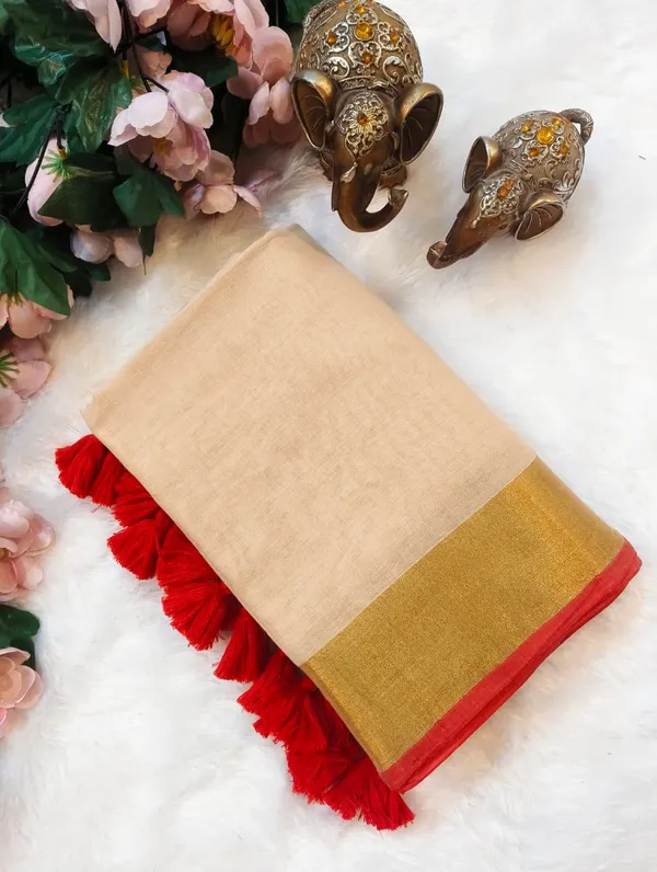 Beige_Cotton_Saree_With_Golden_Border_And_Red_Tassel_Trim