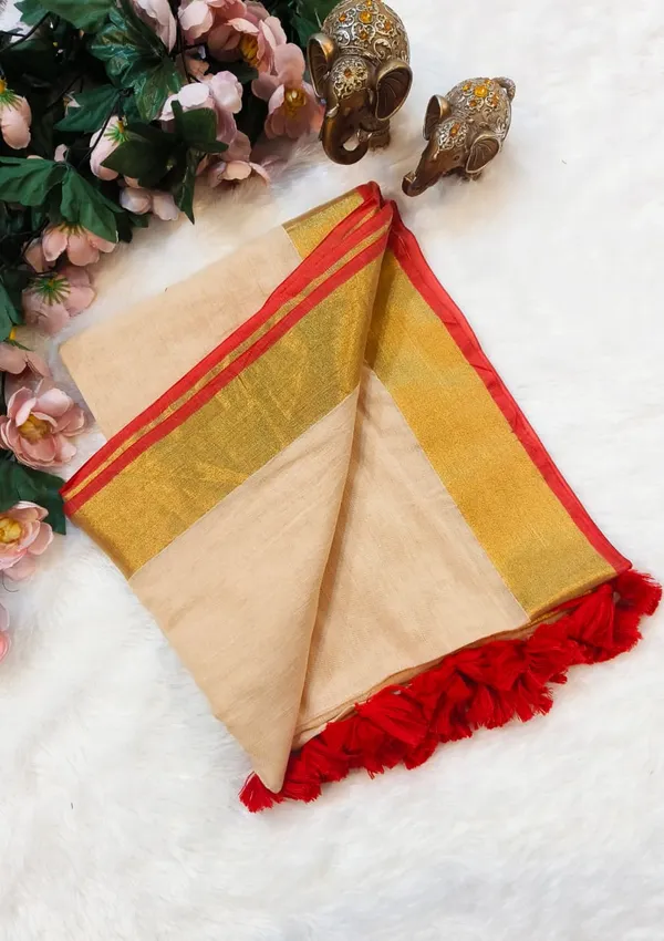 Beige_Cotton_Saree_With_Golden_Border_And_Red_Tassel_Trim