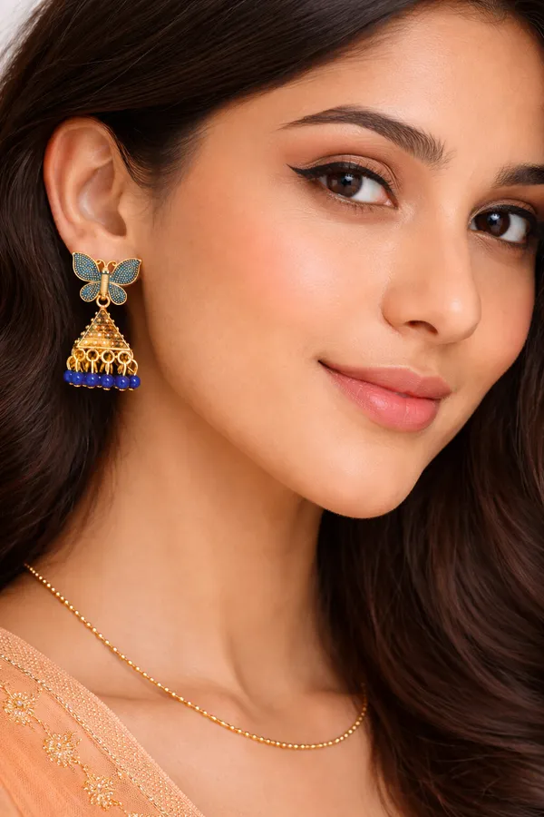 Elegant_butterfly_blue_and_gold_dangling_earrings_adorned_with_sparkling_stones_and_royal_blue_bead_accents