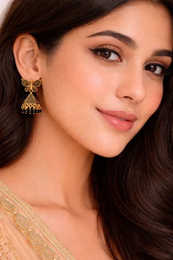 Elegant_butterfly_Black_and_gold_dangling_earrings_adorned_with_sparkling_stones_and_Maroon_bead_accents