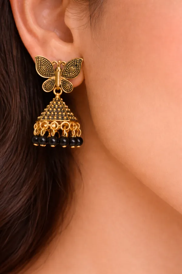 Elegant_butterfly_Black_and_gold_dangling_earrings_adorned_with_sparkling_stones_and_Maroon_bead_accents