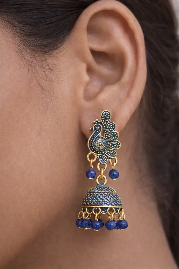 Elegant_peacock-inspired_blue_and_gold_jhumka_earrings_adorned_with_intricate_detailing_and_royal_blue_bead_accents