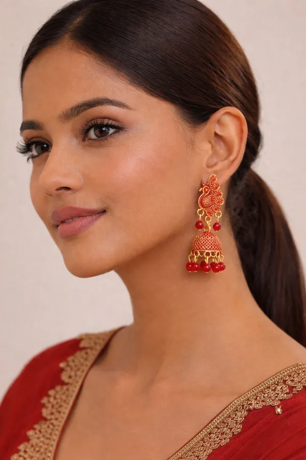 Elegant_peacock-inspired_Red_and_gold_jhumka_earrings_adorned_with_intricate_detailing_and_Red_bead_accents