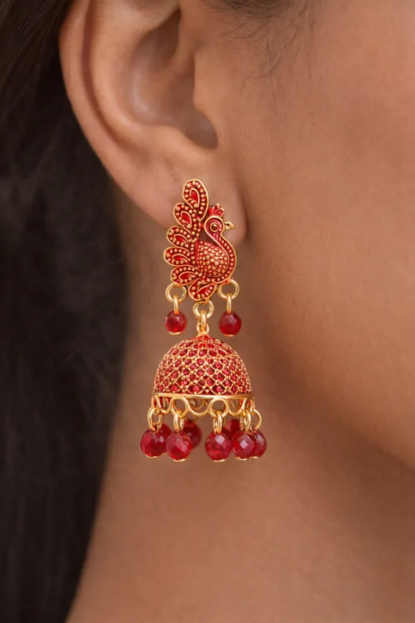 Elegant_peacock-inspired_Red_and_gold_jhumka_earrings_adorned_with_intricate_detailing_and_Red_bead_accents