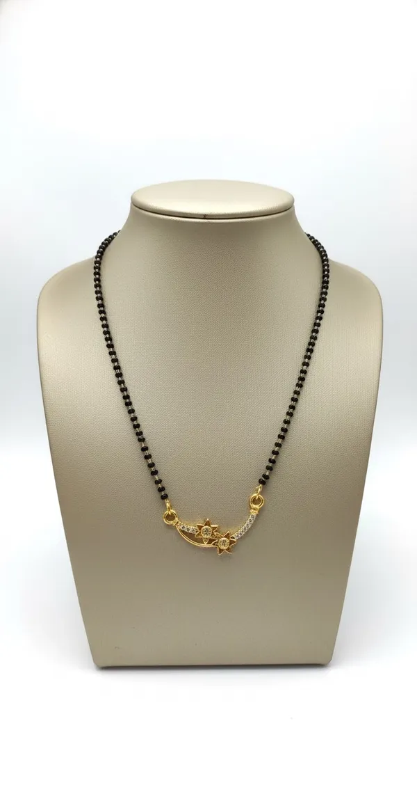 Traditional_gold-tone_mangalsutra_featuring_a_detailed_floral_pendant_with_twin_black_bead_chains