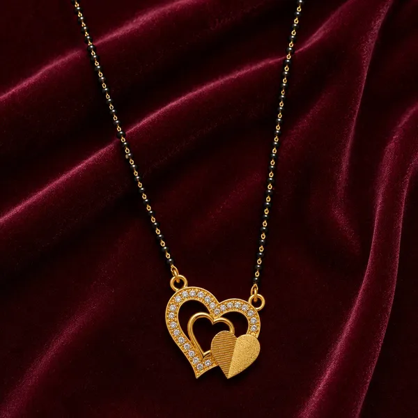 Elegant_gold-tone_mangalsutra_with_twin_black_bead_chains_and_a_sparkling_heart-shaped_pendant